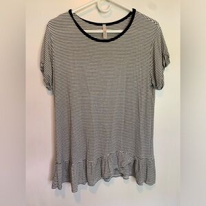 Black and white striped shirt with ruffles on bottom